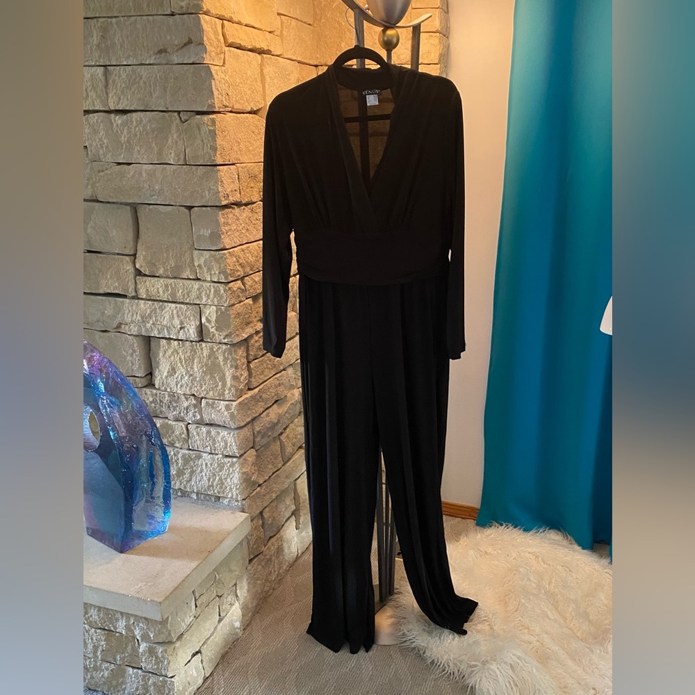 NEW without tags. Black jumpsuit. Size large.